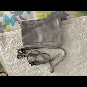 Hobo light gray leather crossbody bag.